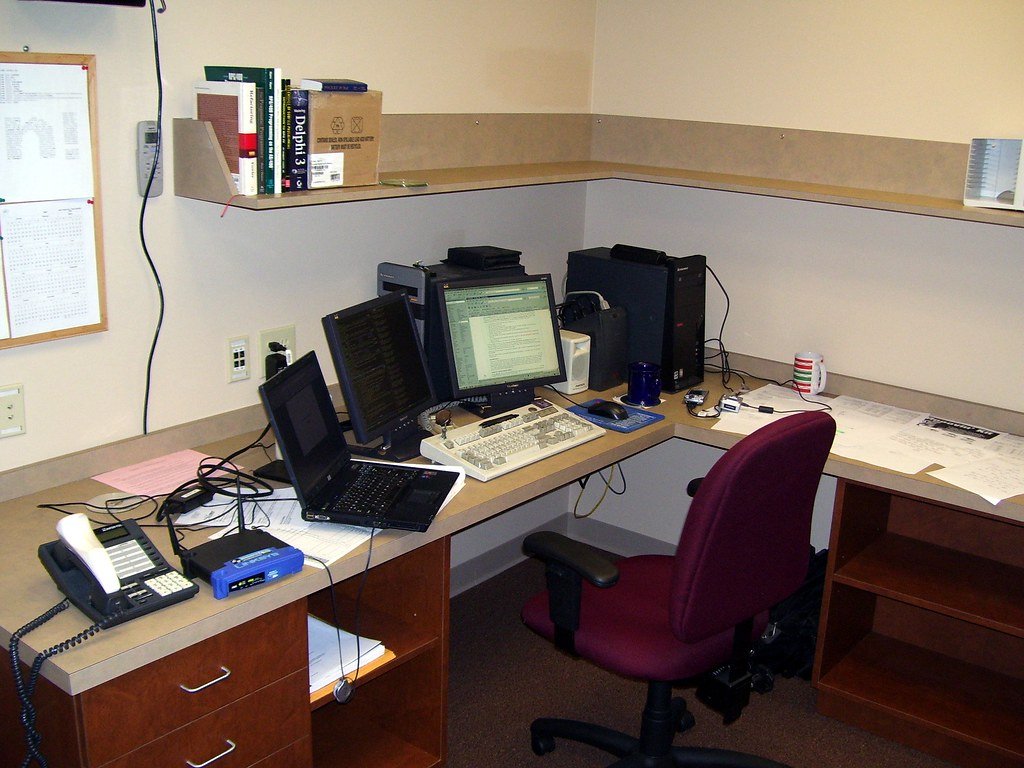 Office workspace showing productivity challenges with generic software tools